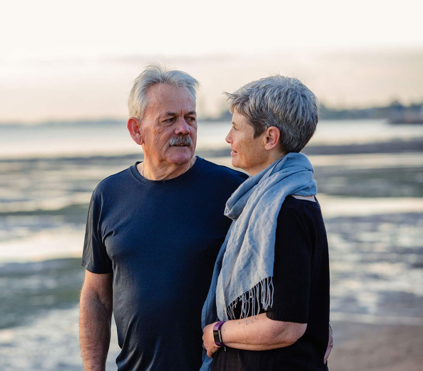 John Quinn with wife on a beach