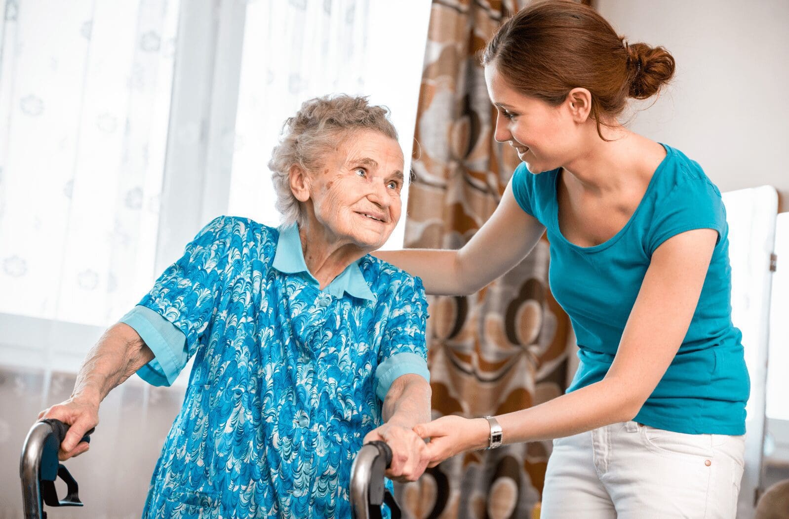 Elderly lady being assisted by her support worker