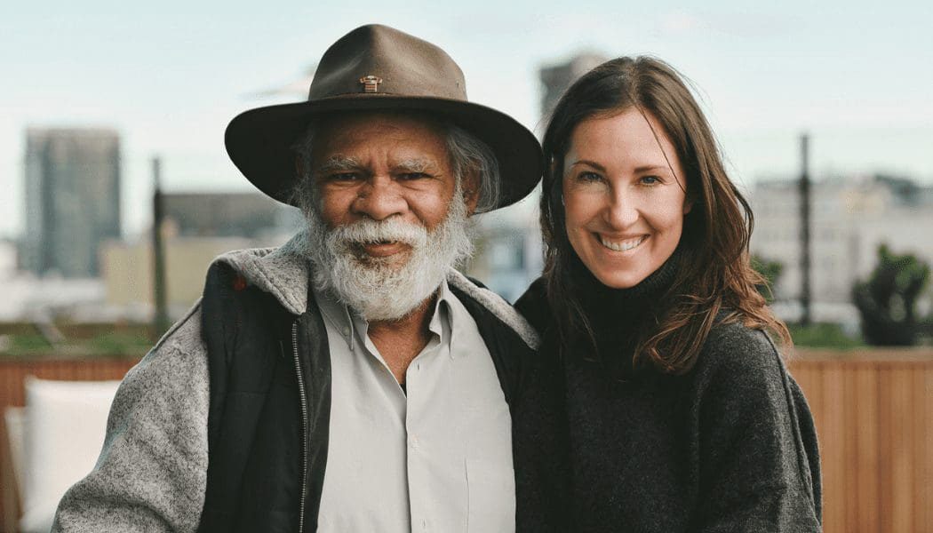 Indigenous senior man with a female support worker